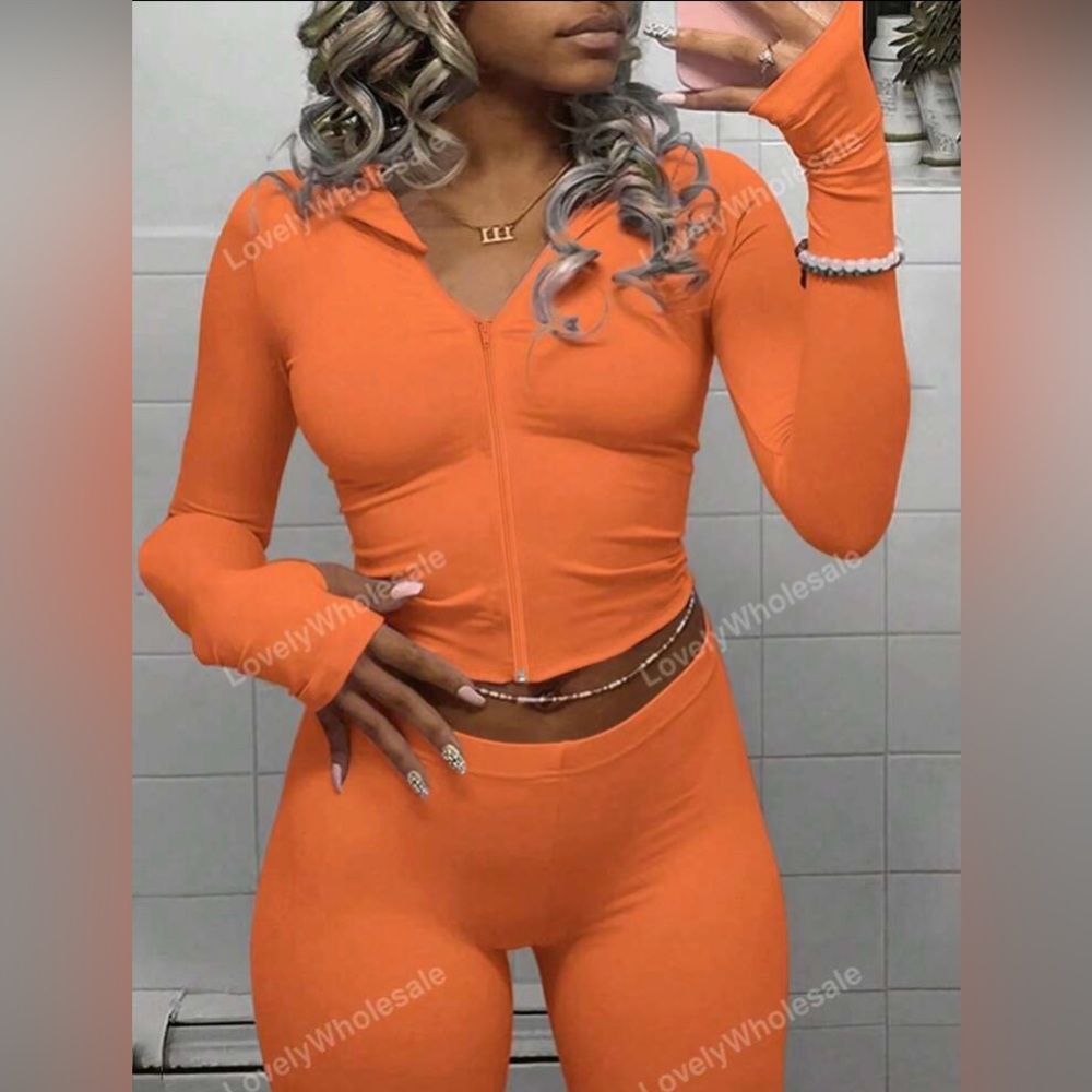 Brand new orange zip up sweater size L